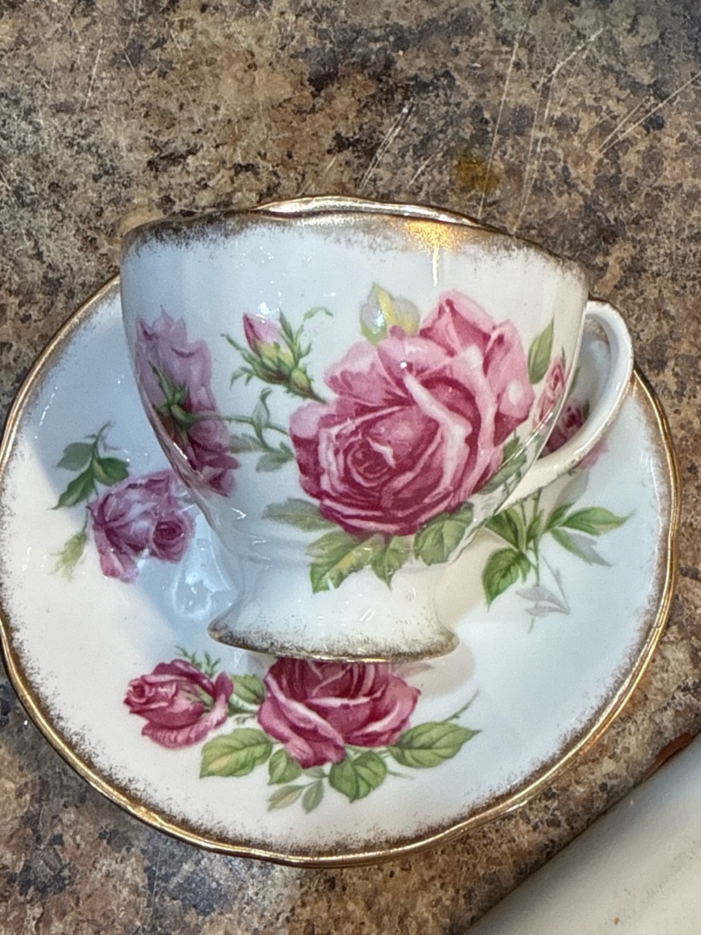 Porcelain Teacup and Saucer Set with Pink Rose Pattern and Gold Trim